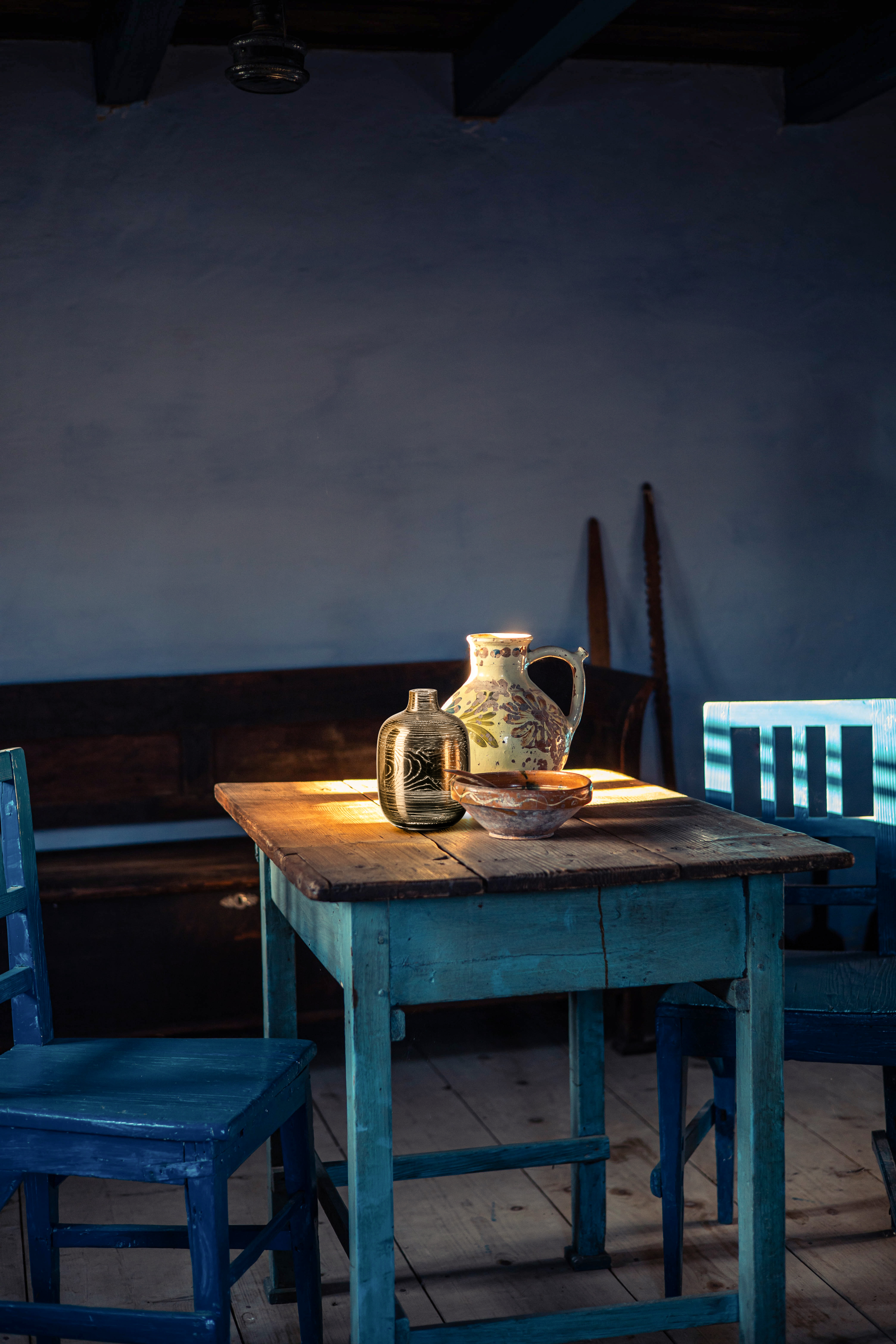 Golden vase on blue table
