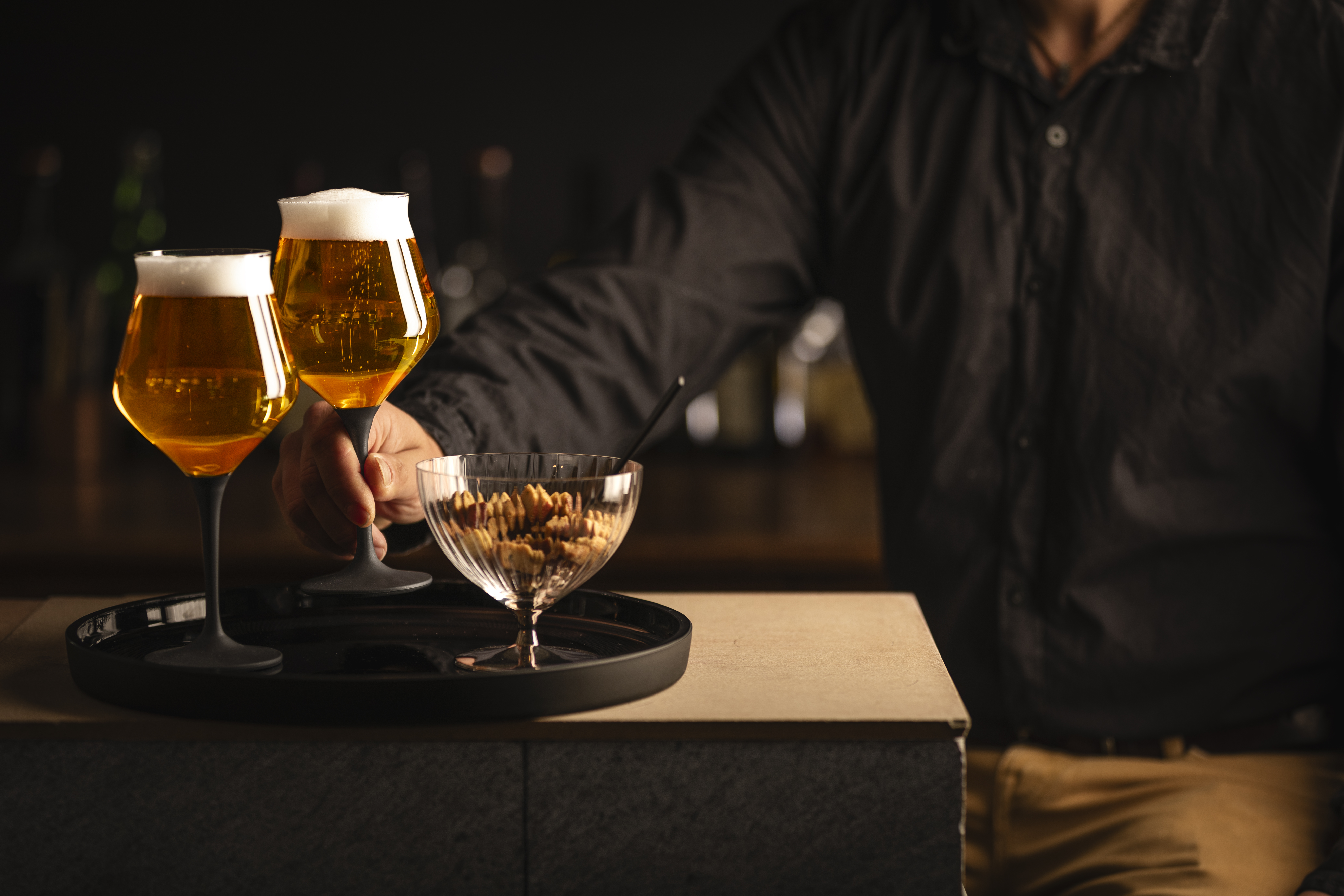 Craft beer mug and dessert bowl on a tray