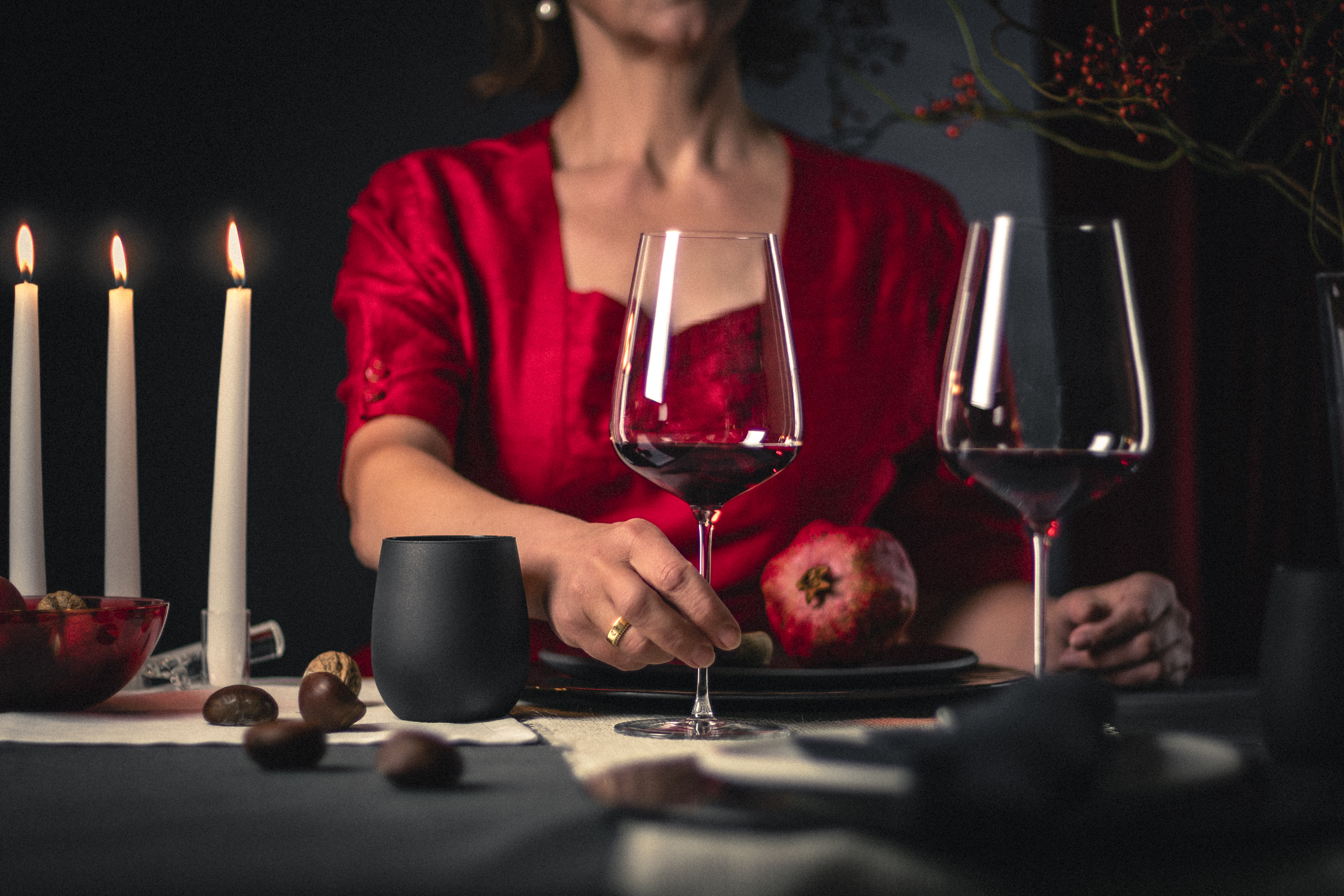 Woman with two red wine glasses