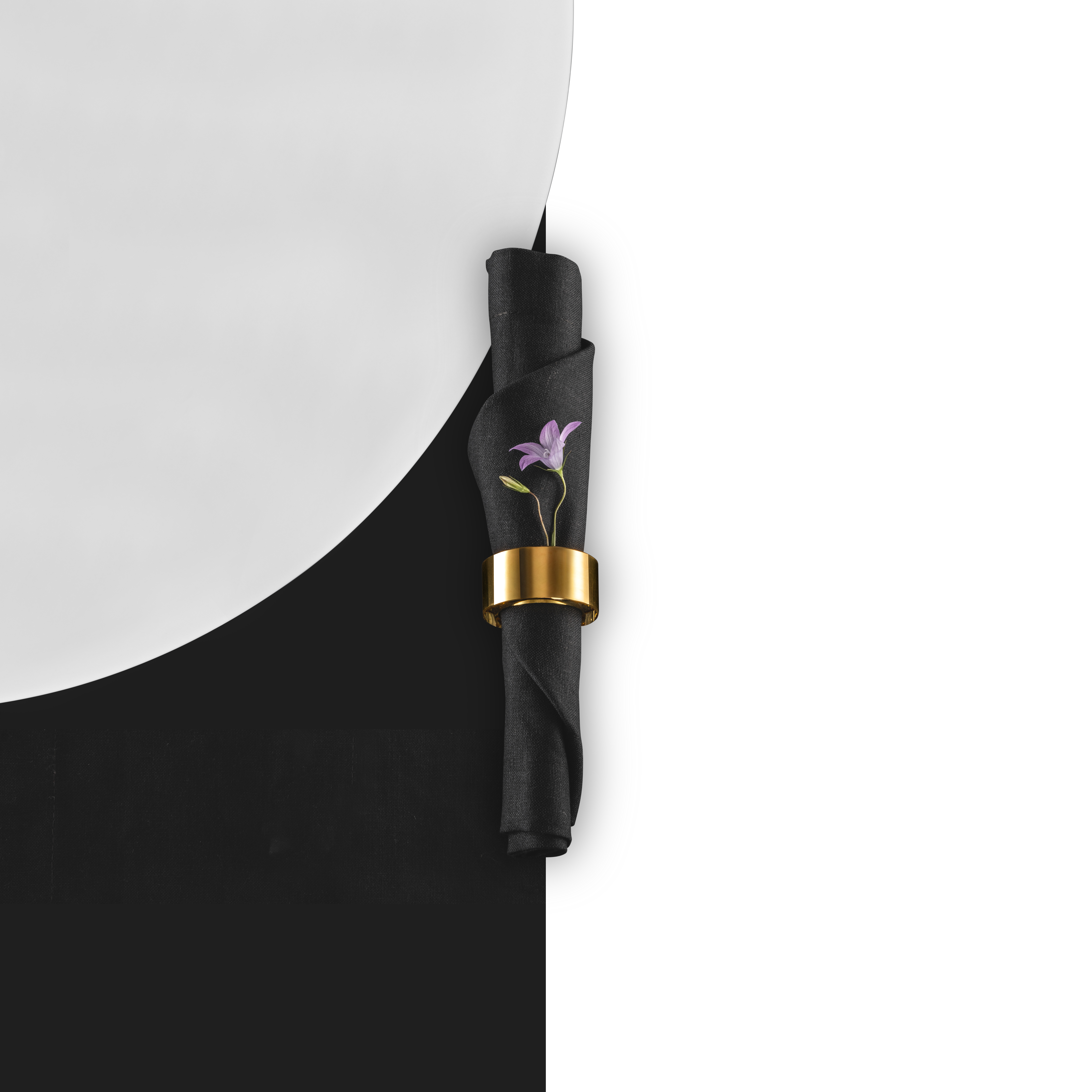 10 carat napkin ring with purple flower and black napkin