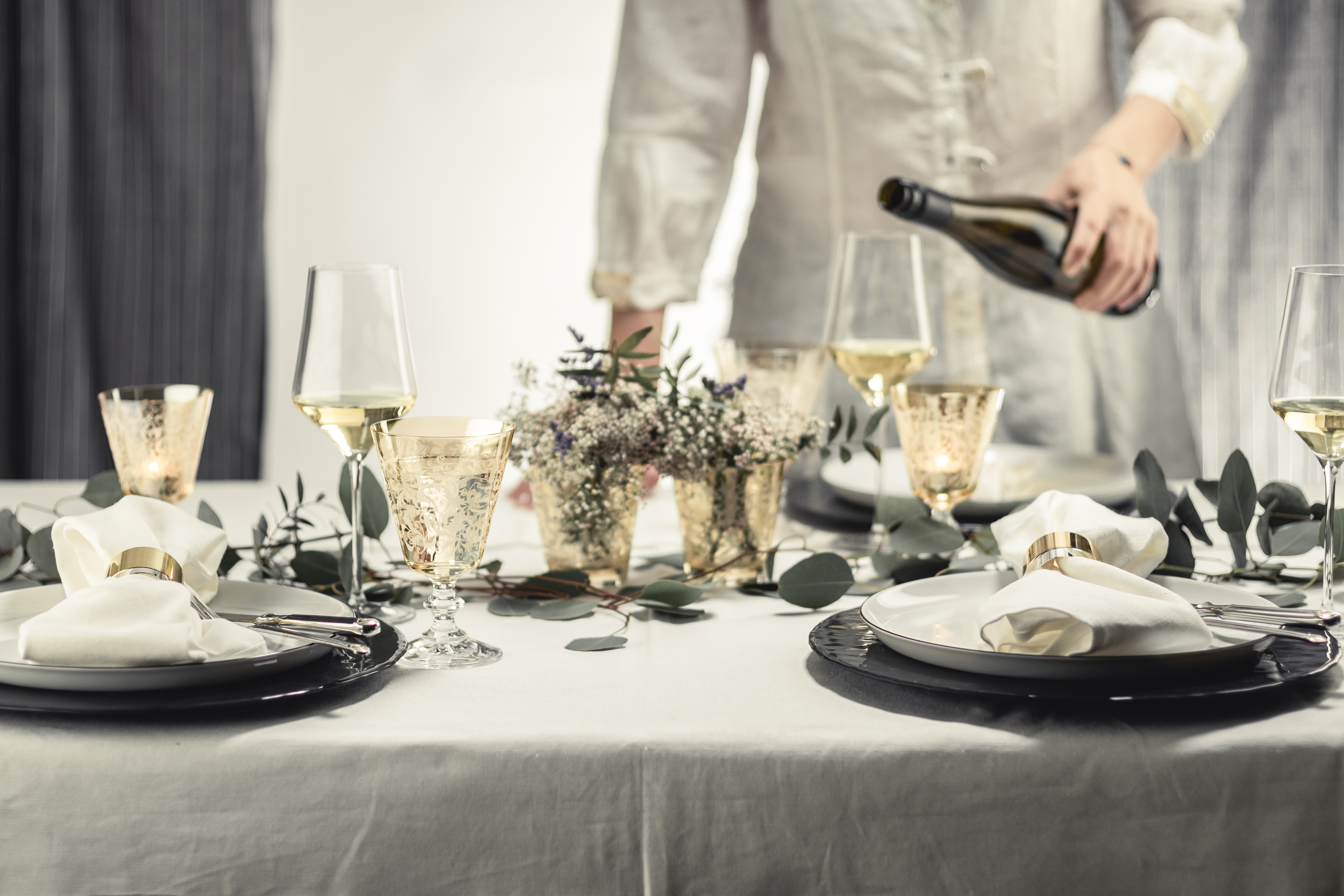 Elegantly laid table in shades of amber with wine glasses