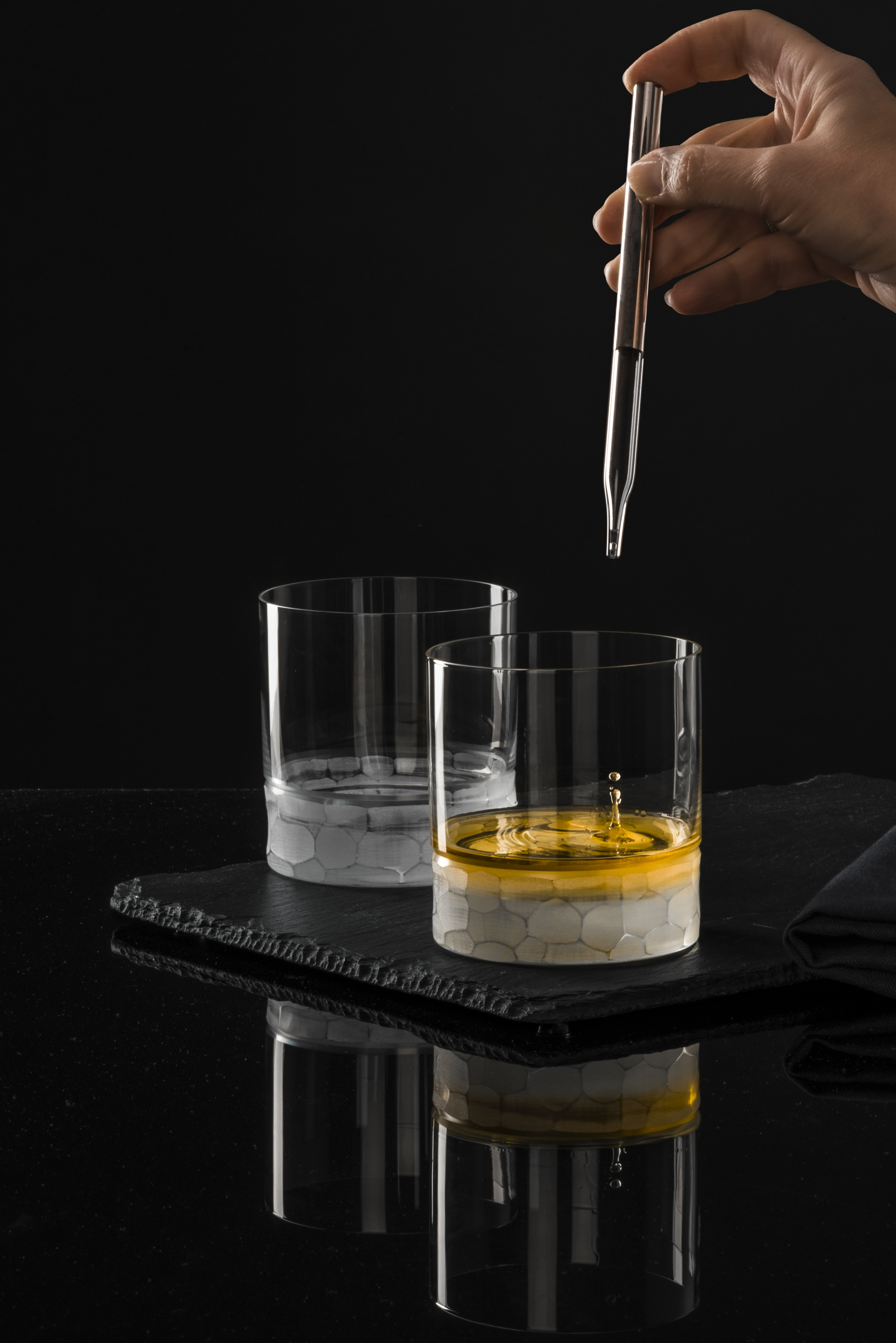 Two whisky glasses with whisky pipette