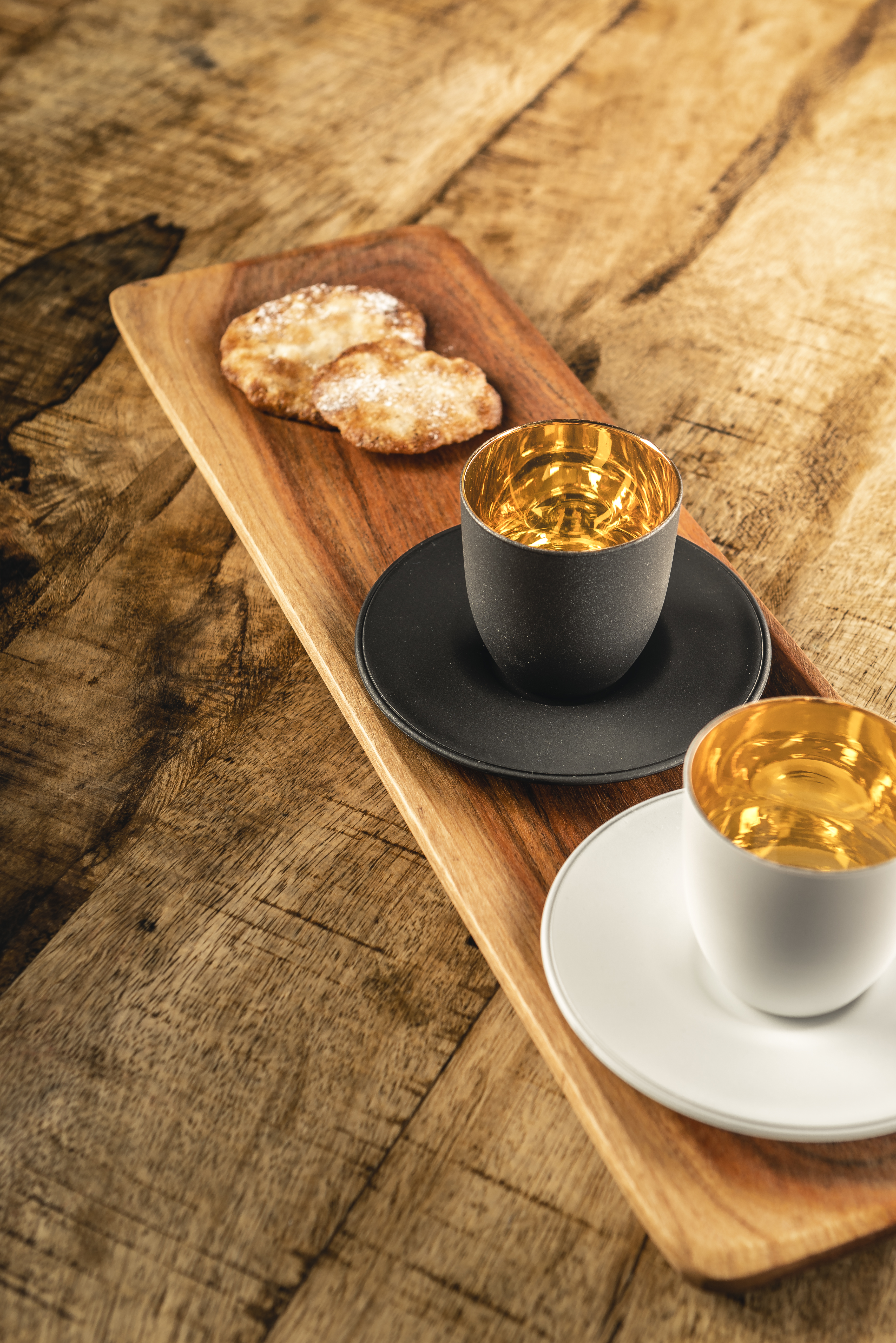 White and black Cosmo Gold espresso glass on wooden tray