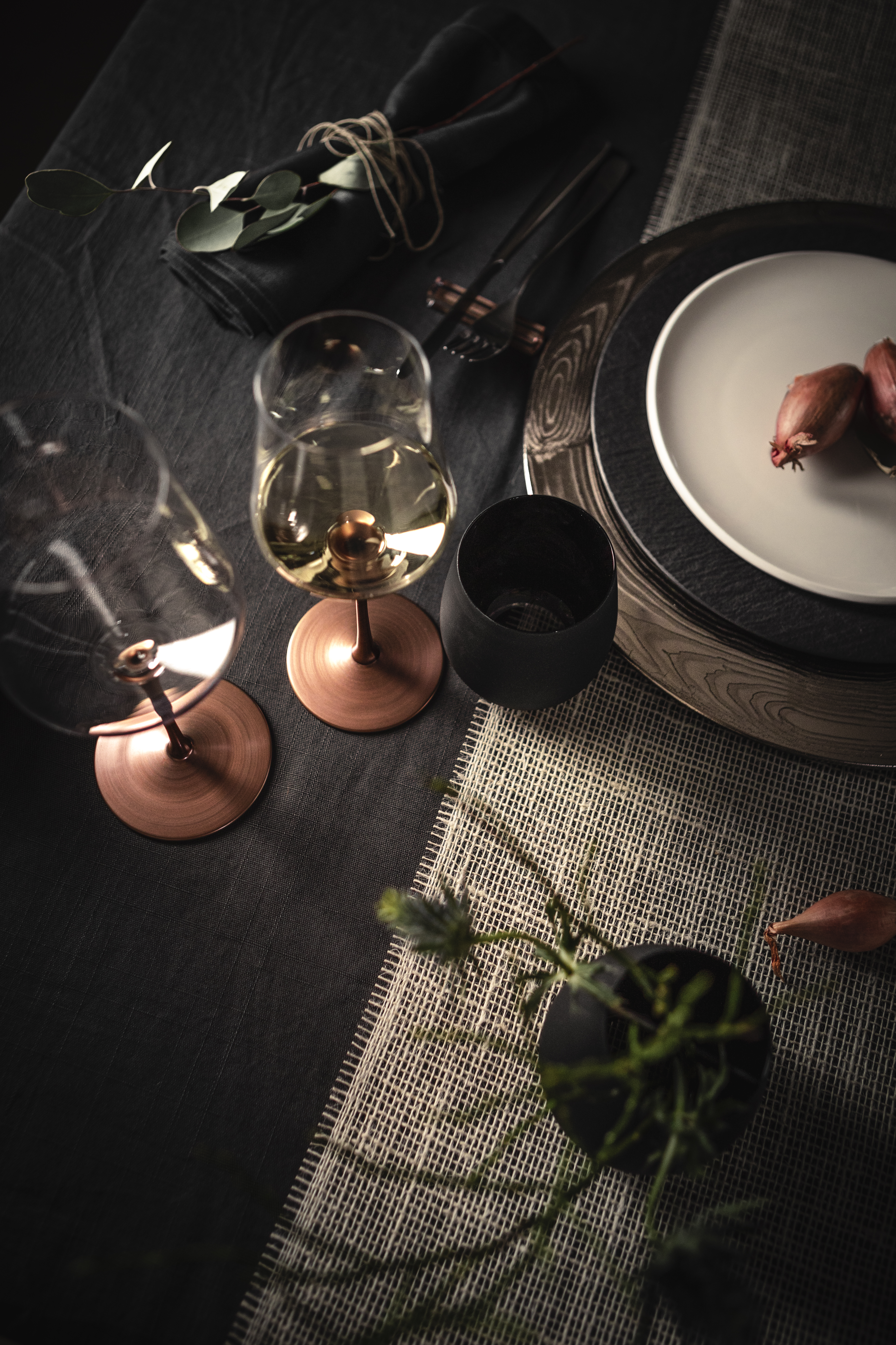 Copper-coloured wine glasses on table