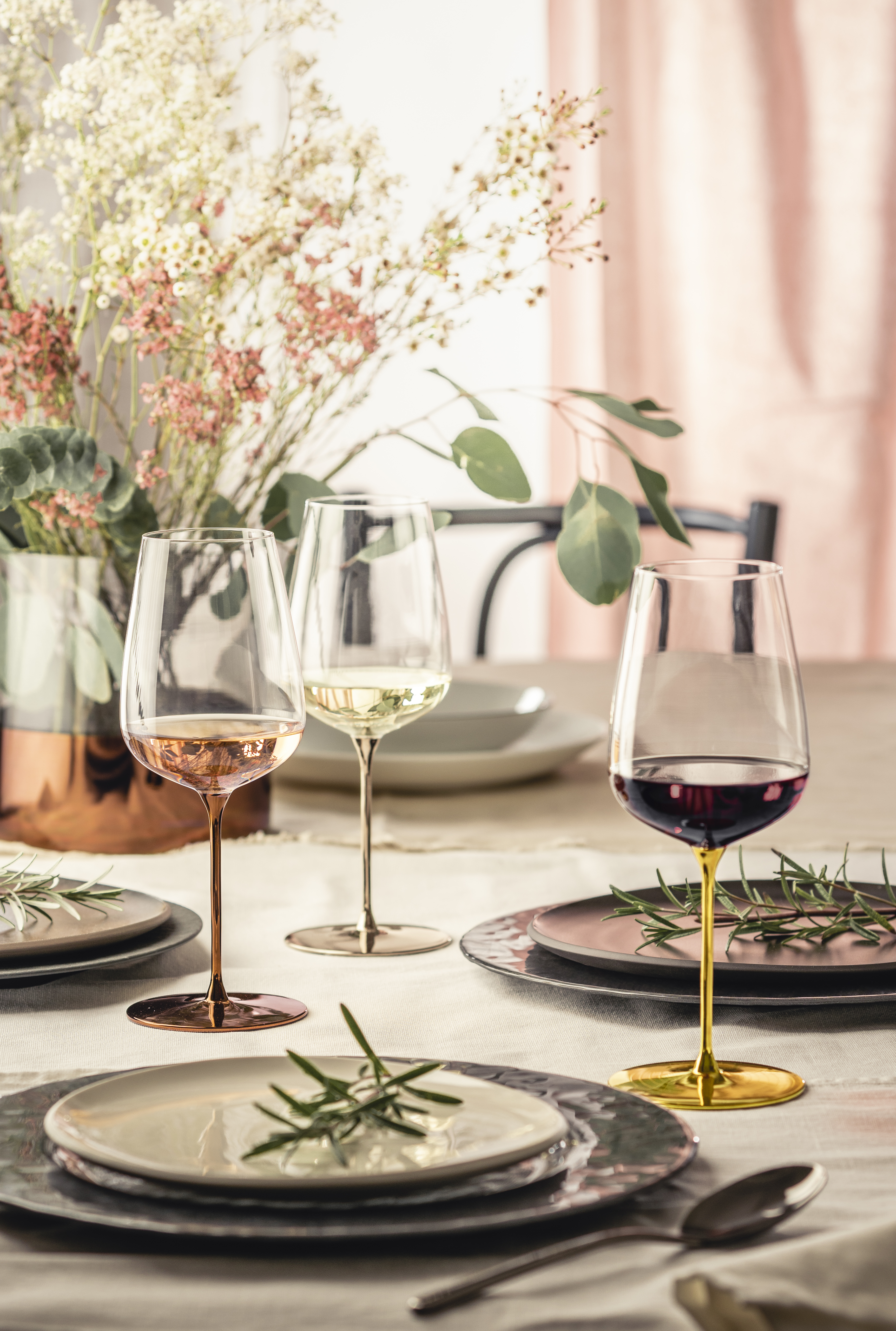 Three glasses in different precious metal colours