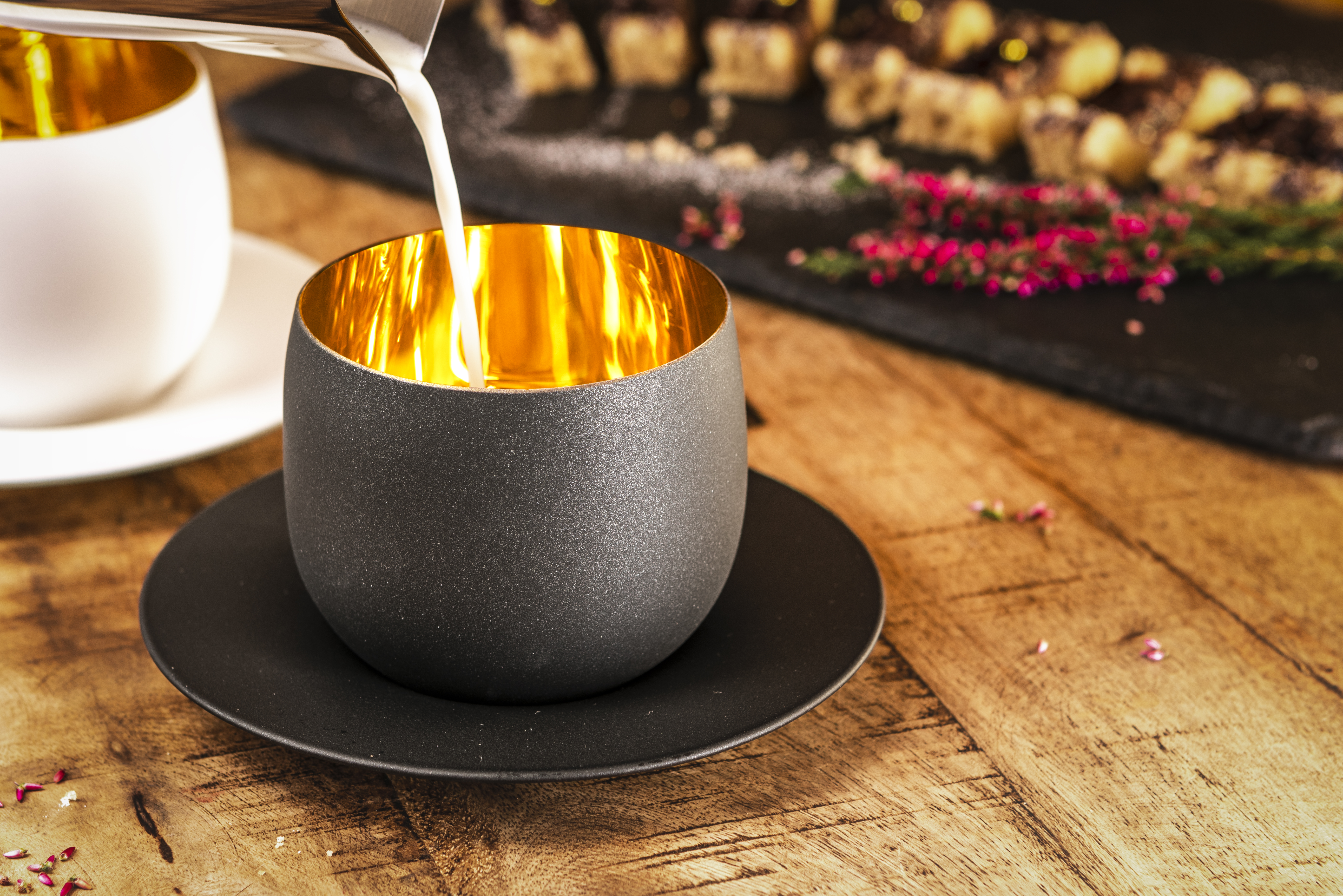 Milk being poured into Cosmo Gold cappuccino glass