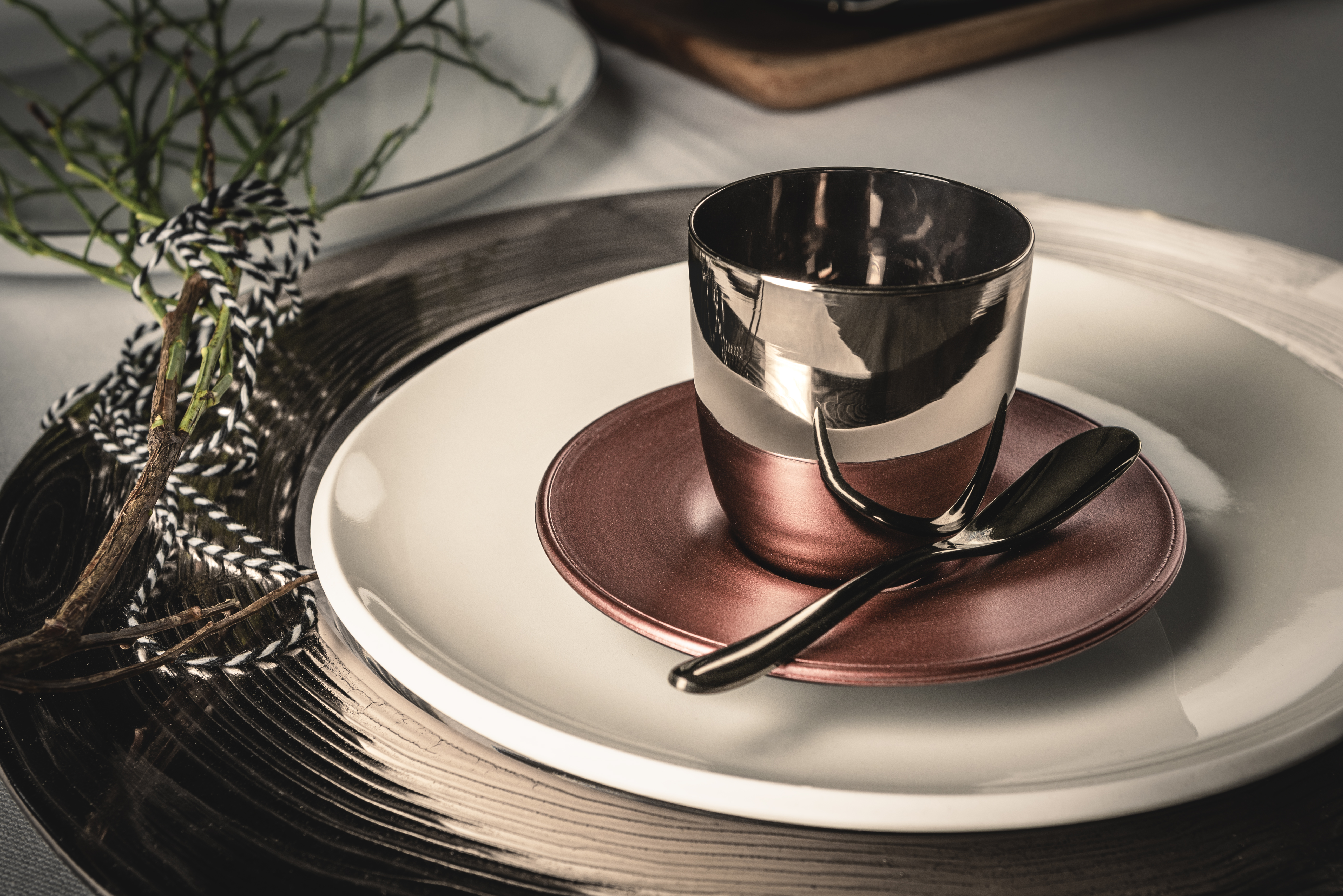 Platinum/copper espresso glass on white porcelain plate