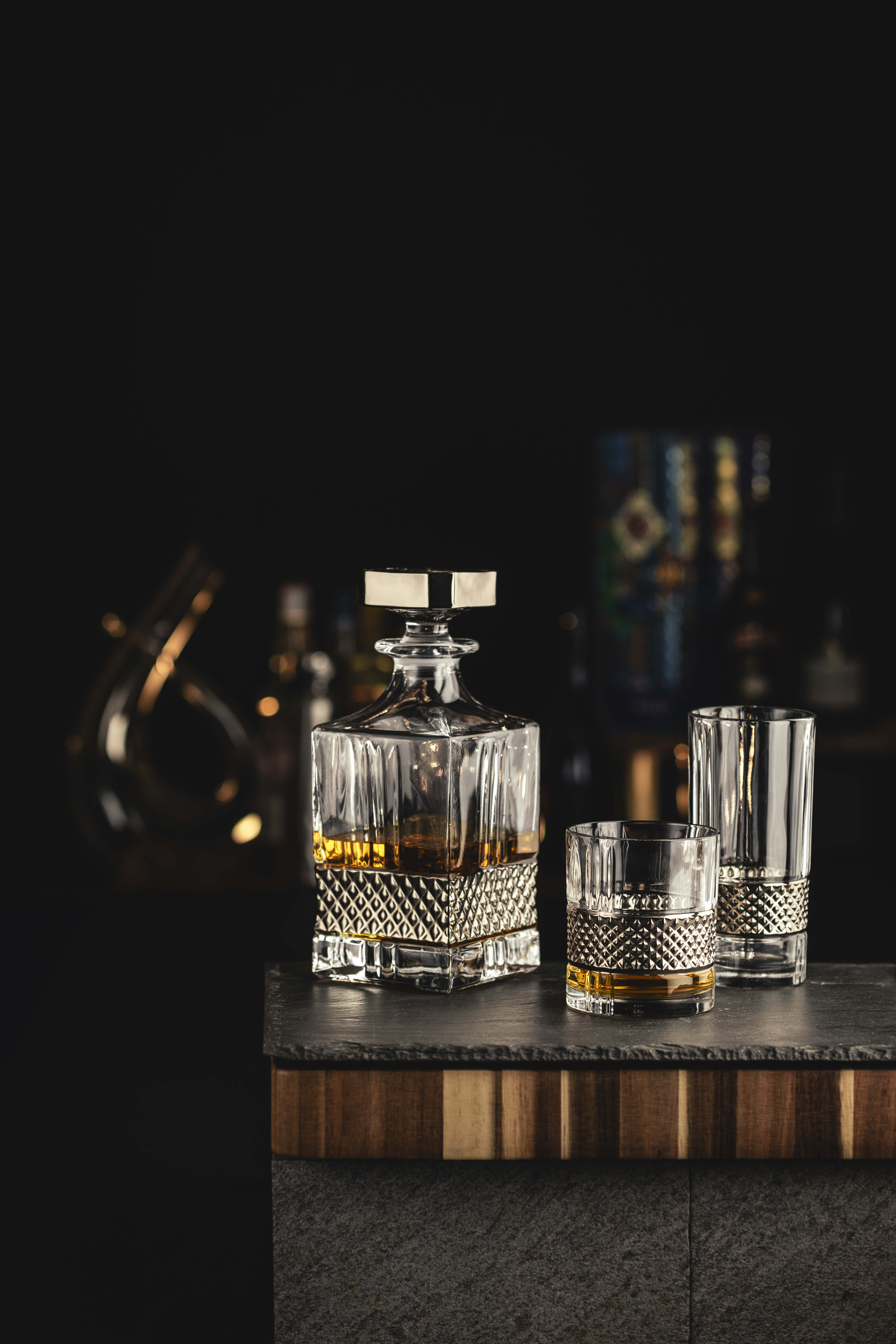 Platinum whisky decanter with matching glasses on bar