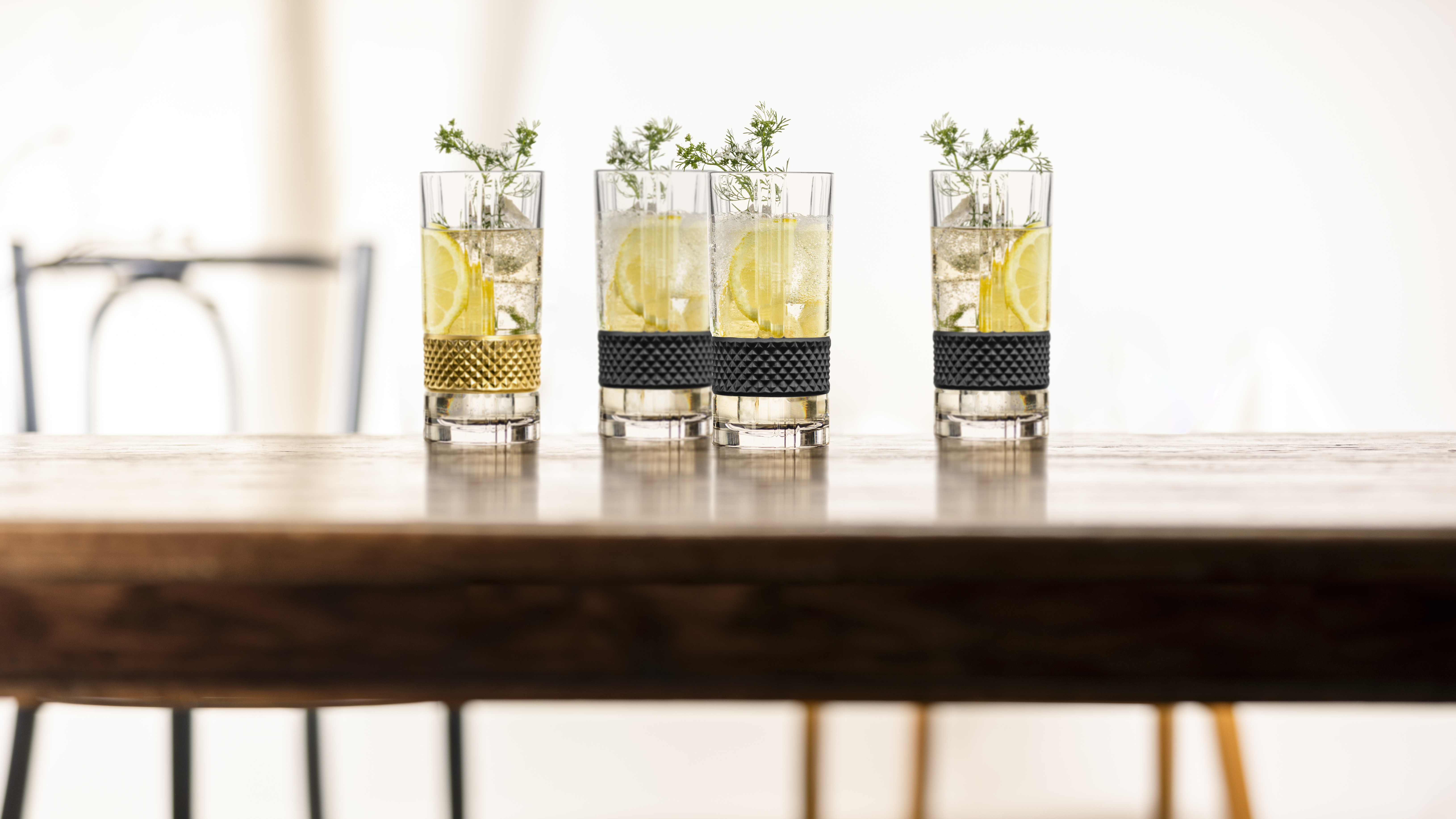 Filled long drink glasses on table