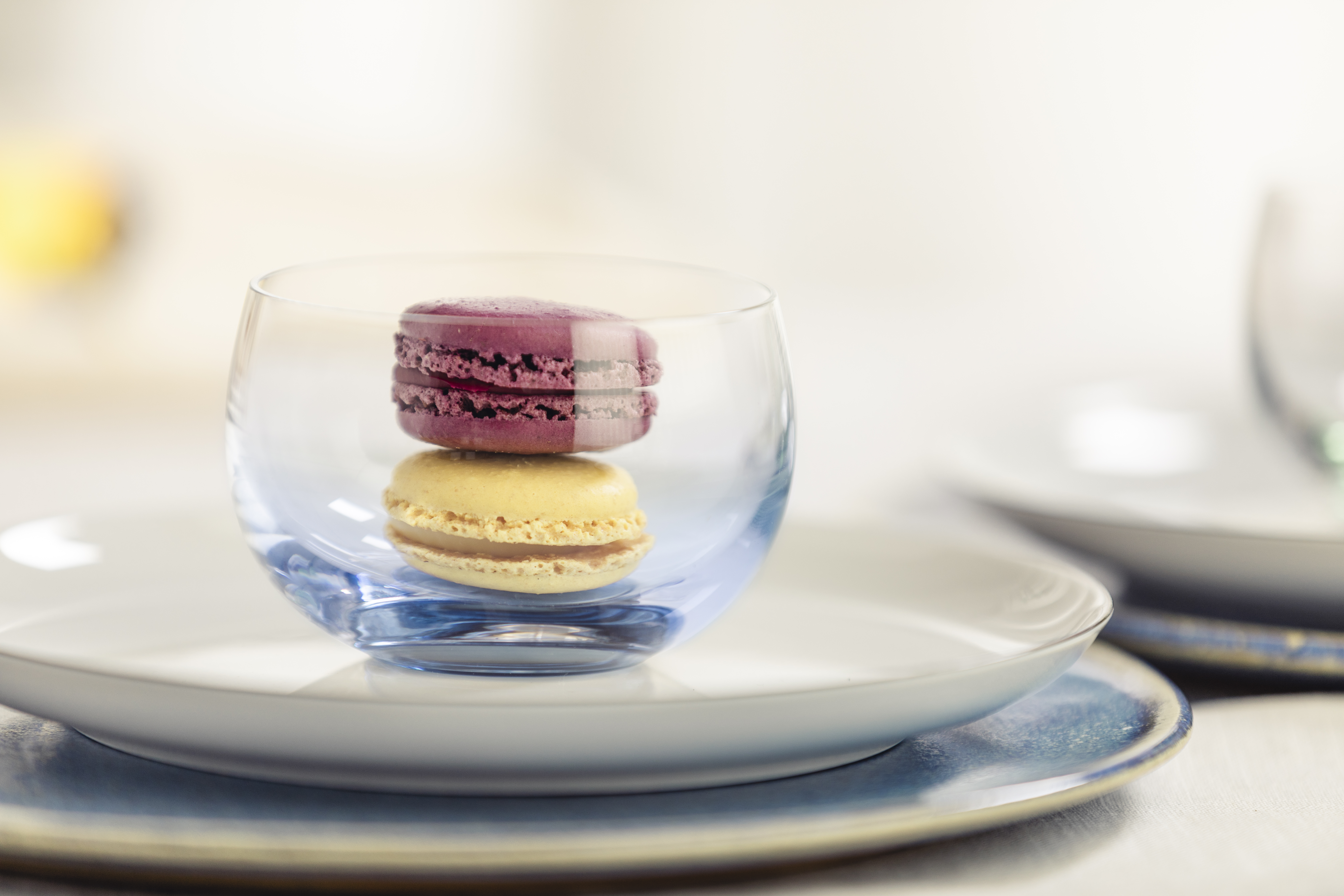 Blue dessert bowl with two macarons inside