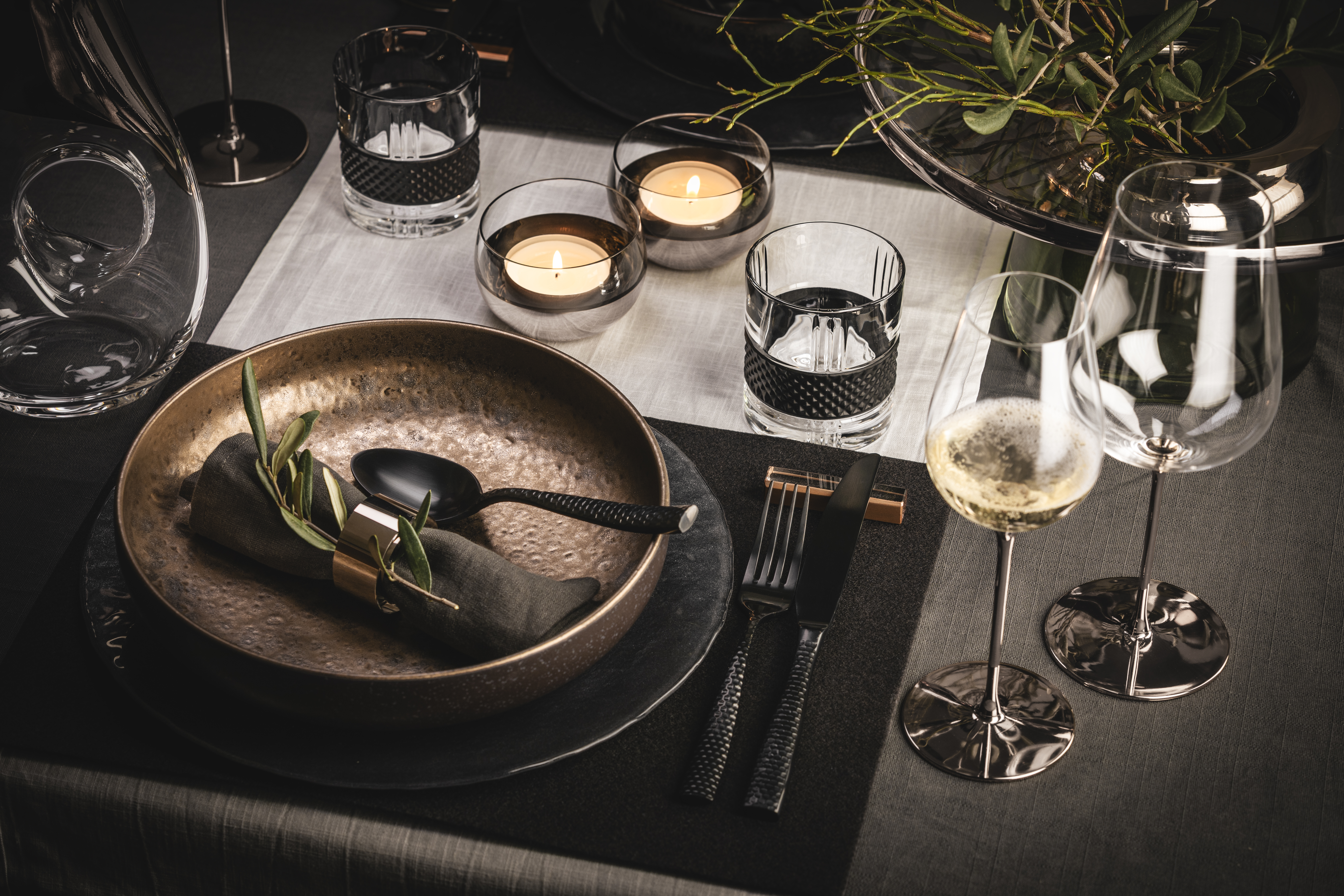 Stylishly laid table in platinum and black tones
