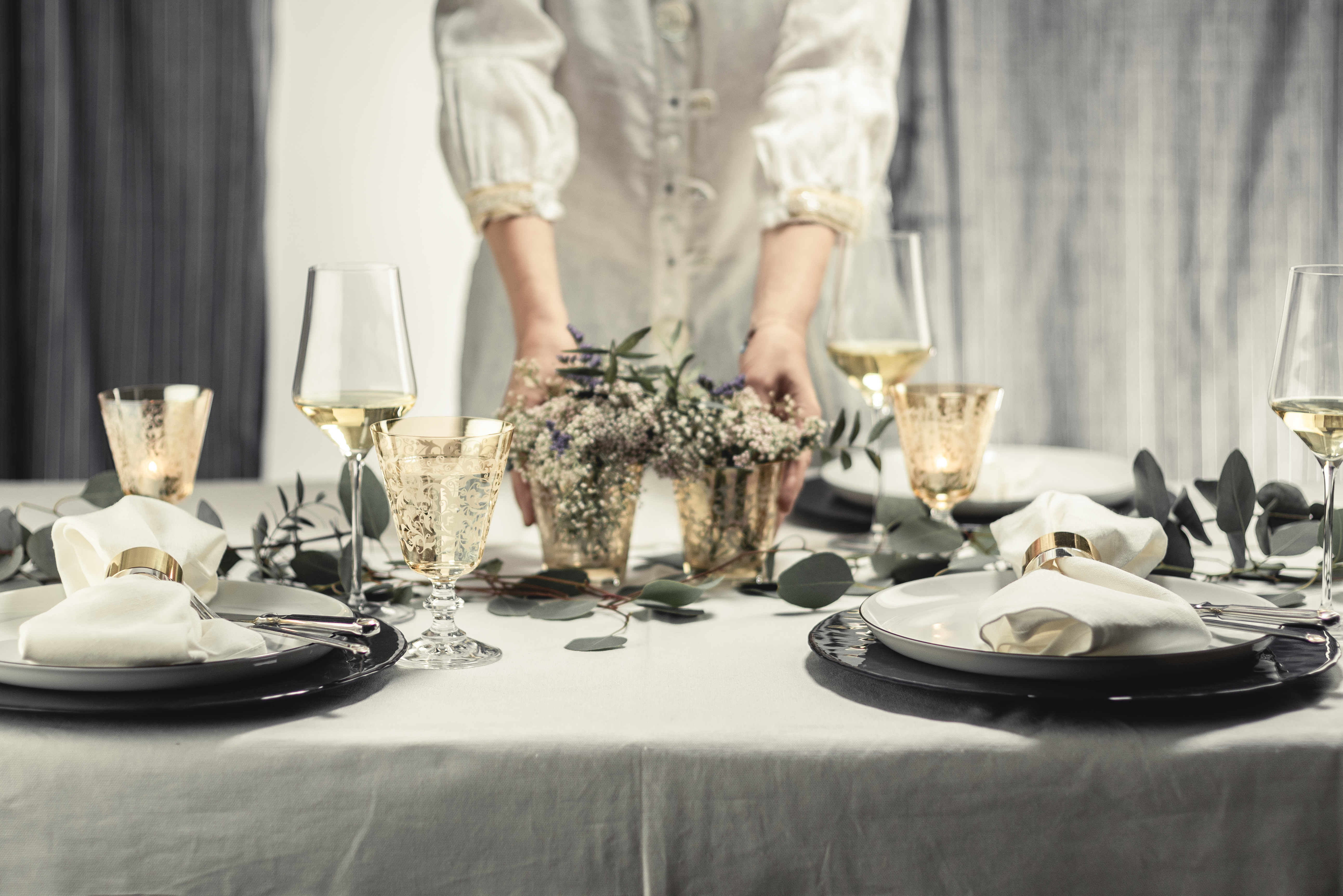 Elegantly laid table in white and copper tones