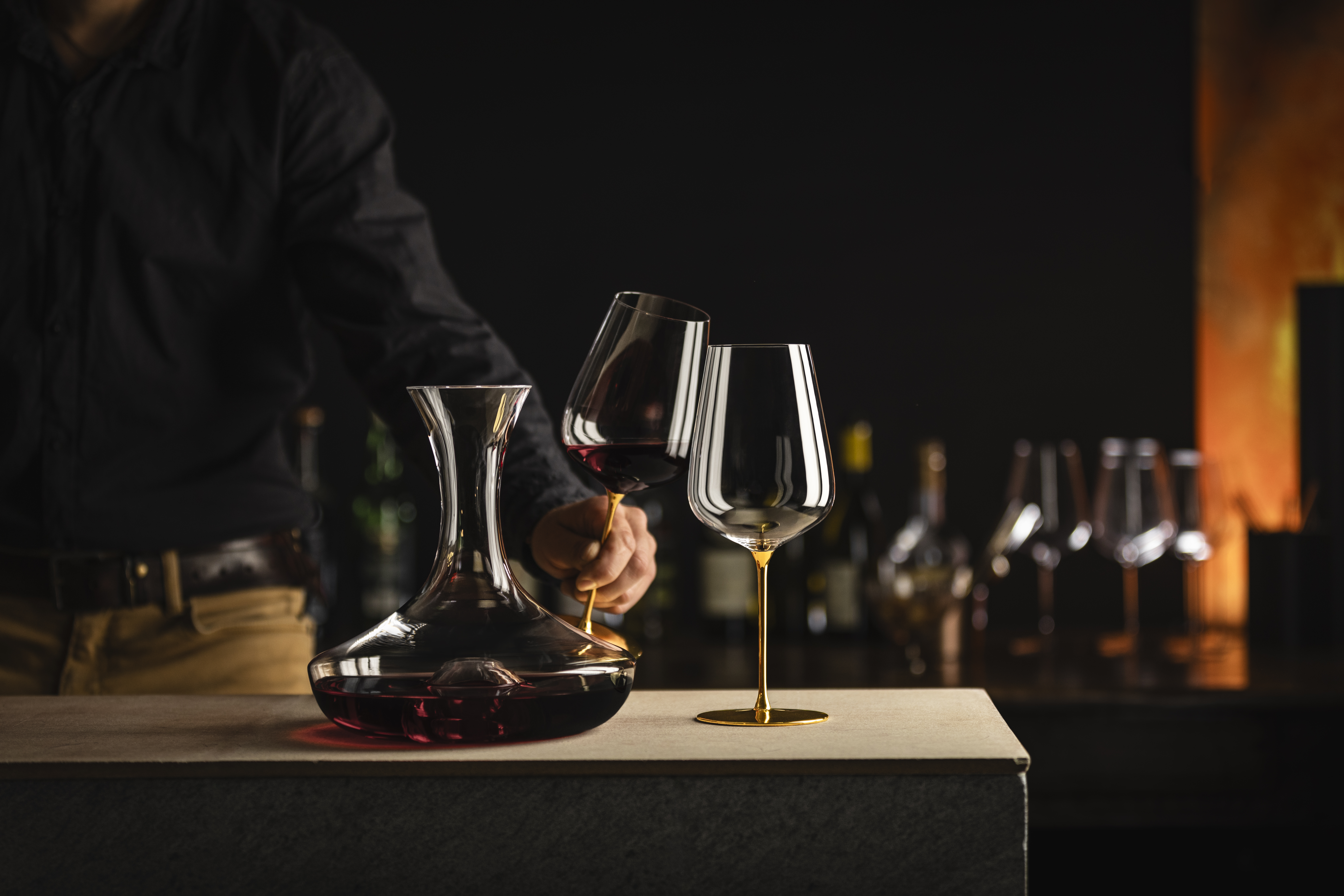 Decanter with two golden wine glasses