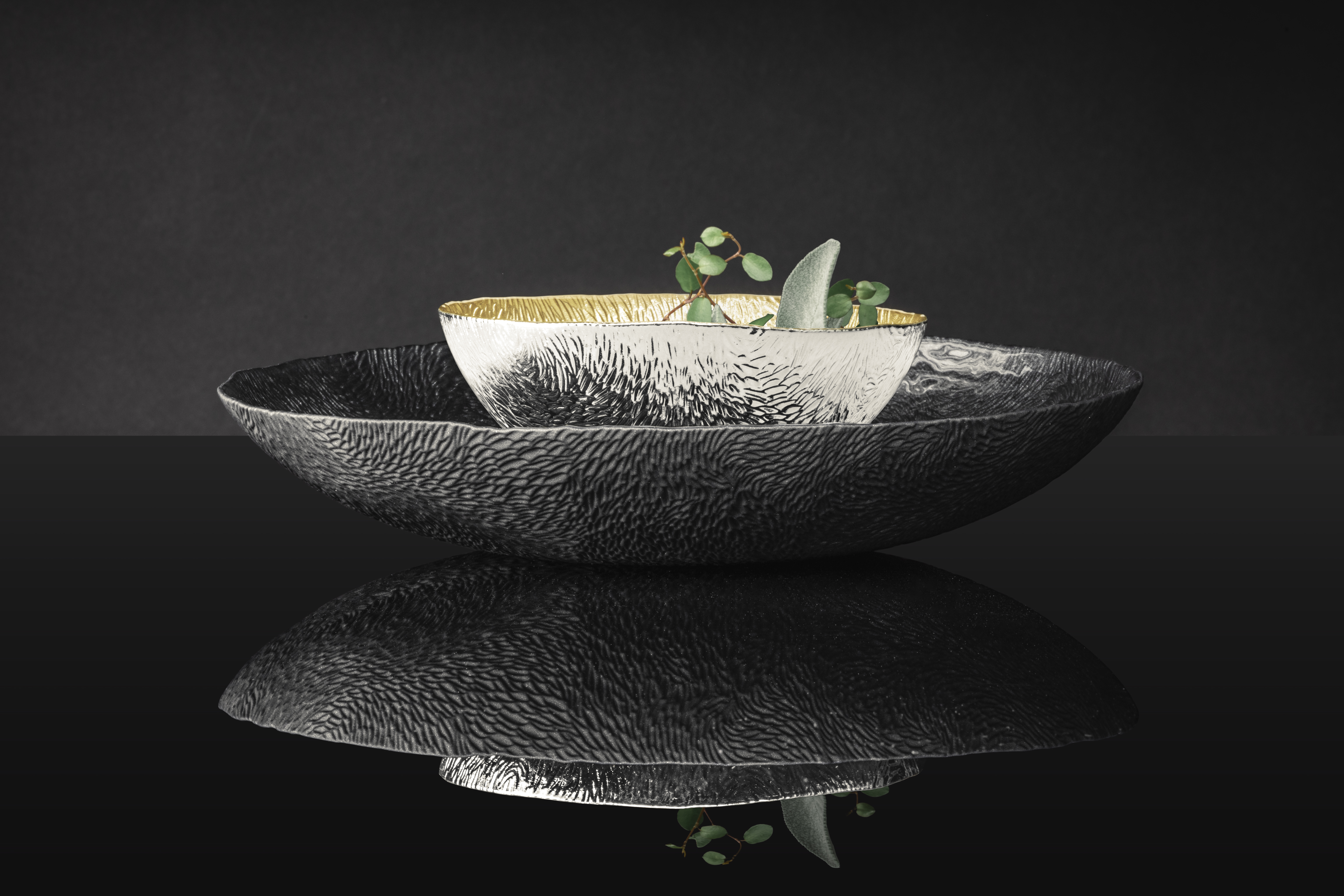 Silver Sen bowl on a black Sen plate