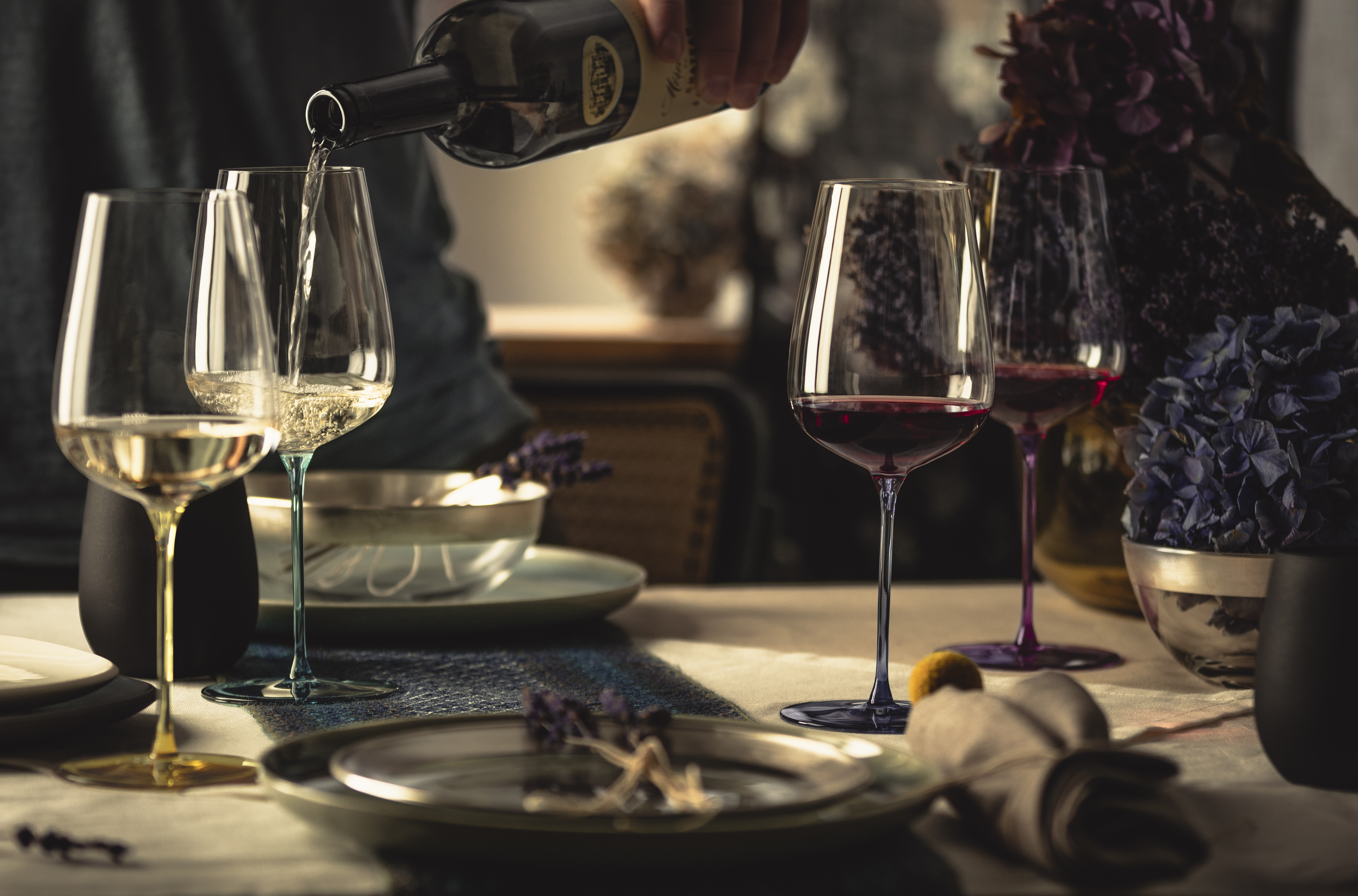 Four different wine glasses on a table